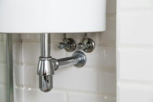 Basin siphon or sink drain in a bathroom, clean - V-Max Plumbing