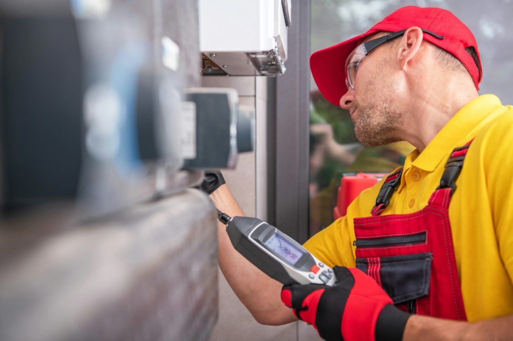 Technician with Gas Leak Detector Performing Scheduled Check